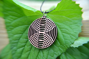 Mirror Image Circle Pendant in cherry on leather cord